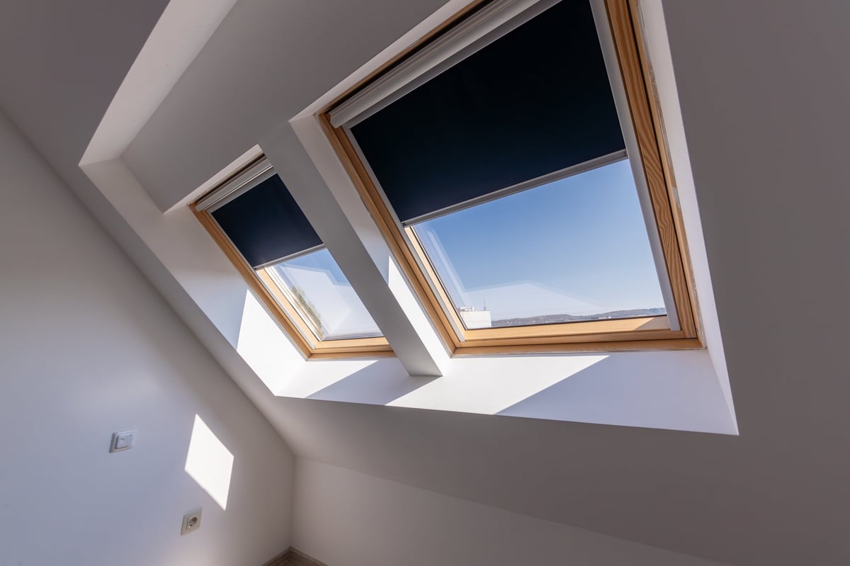 Interior shot of roof windows and dormer windows with skylight, showcasing modern residential architecture and natural daylight