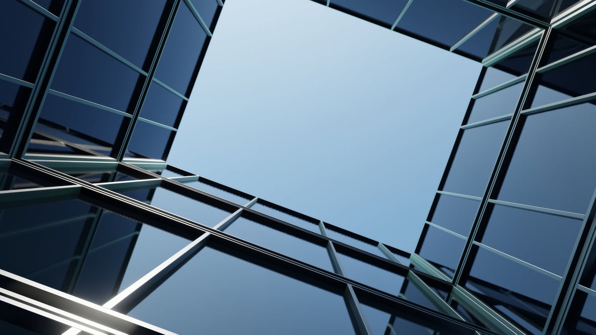 Modern architectural design featuring glass facade with reflective surfaces