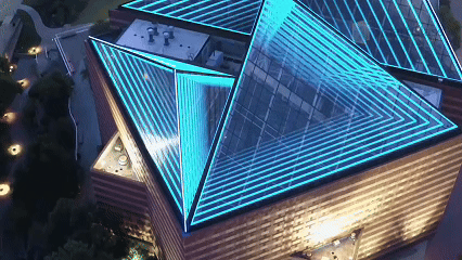 Exterior digital signage display showing dynamic smart glass technology