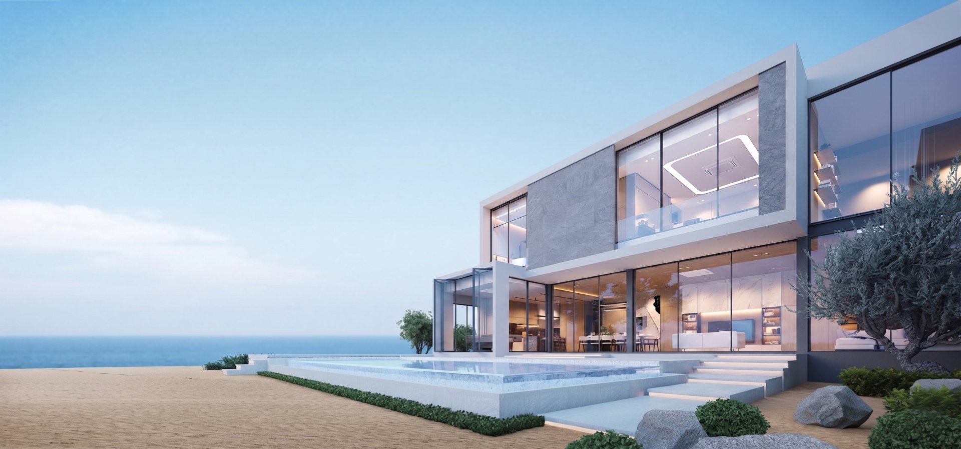 Modern beachfront house with floor-to-ceiling windows, infinity pool, and minimalist landscaping overlooking the ocean at sunset